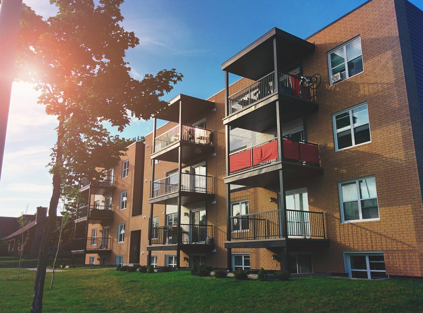 Condominium building with balconies in afternoon light